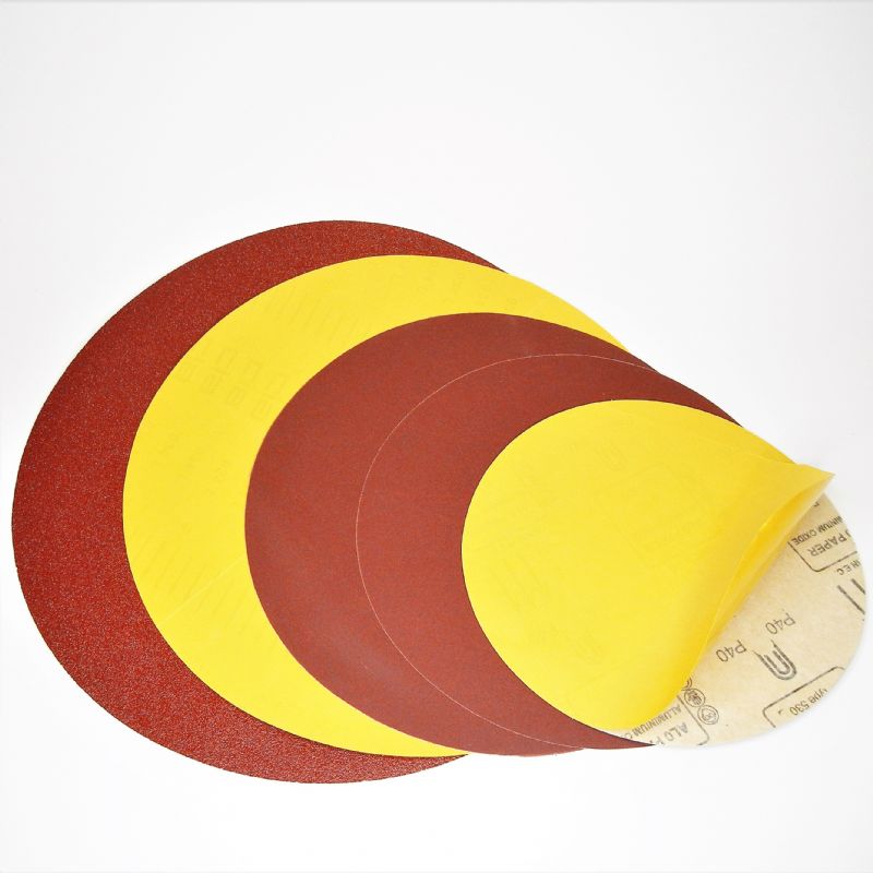 dischi carta abrasiva resinata rossa pesante + adesivo tranciati d. mm. 1100 p 36 a tipo corindone