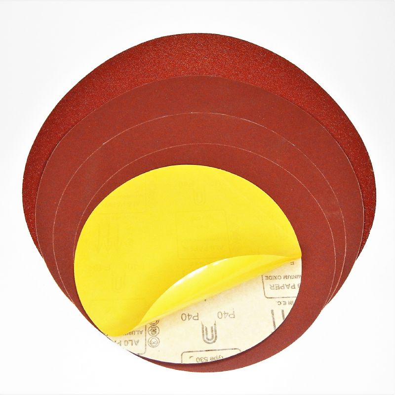 dischi abrasivi in carta resinata rossa pesante + adesivo tranciati d. mm. 700 p 36 a tipo corindone