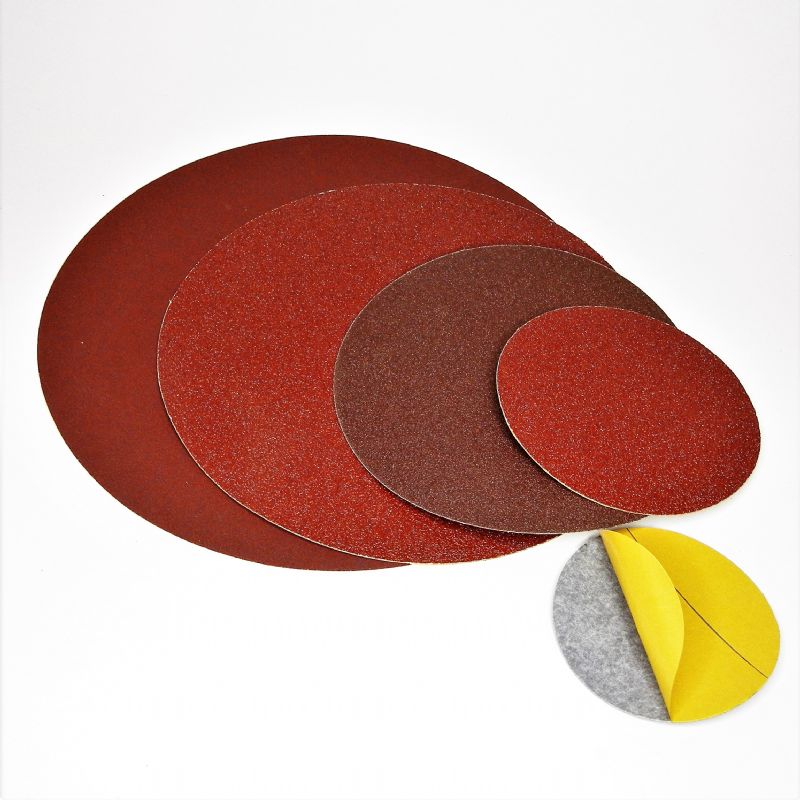 dischi abrasivi in carta resinata rossa pesante + adesivo tranciati d. mm. 100 p 180 a tipo corindone